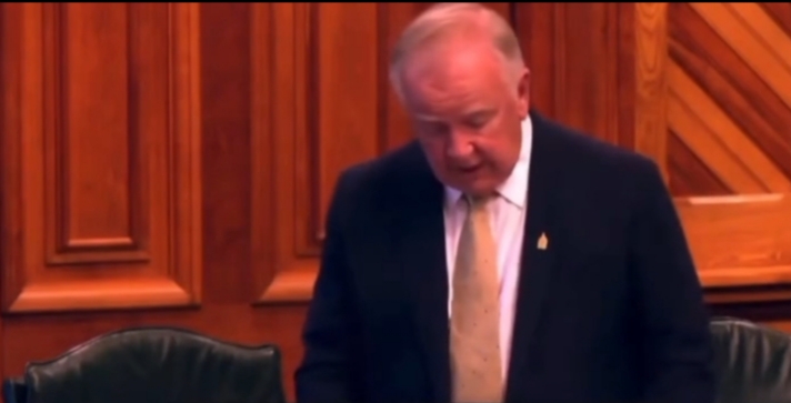 Bill Oliver speaking in the New Brunswick legislature.